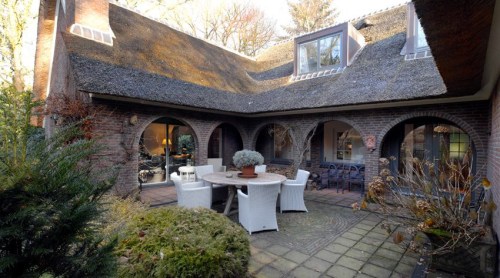 The house is built in a horse shoe shape so features a secluded patio with a veranda. 