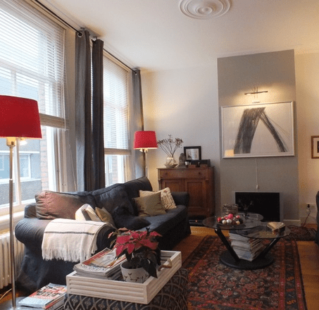 Our sitting room. I have since added an antique chair and a dark green/black glass designer's coffee table where the ottoman is in the picture. 